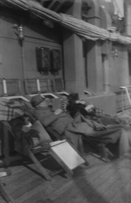 [David and Margaret Lloyd George sitting on recliners aboard a ship]