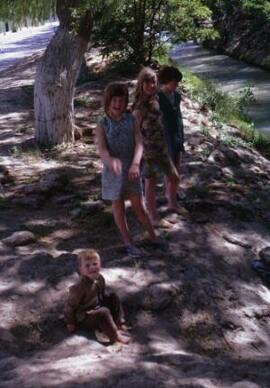 [Four smiling children]