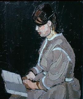 [Karla reading, facing right].