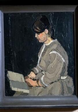 [Karla reading, facing left ]