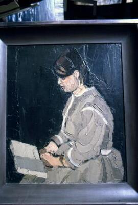 [Karla reading, facing left]