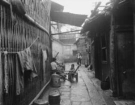 [Alleyway with children playing]