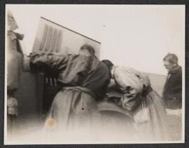 Gareth bending over bonnet