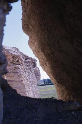 [Cliffs at Lle Cul seen through a rock crevice]